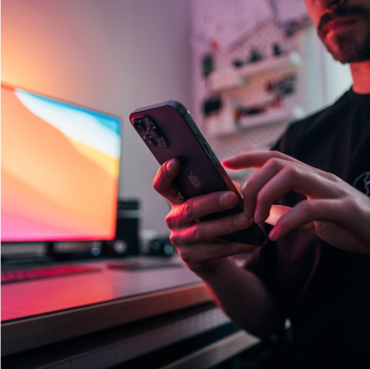 man on phone with mutli-colored screen